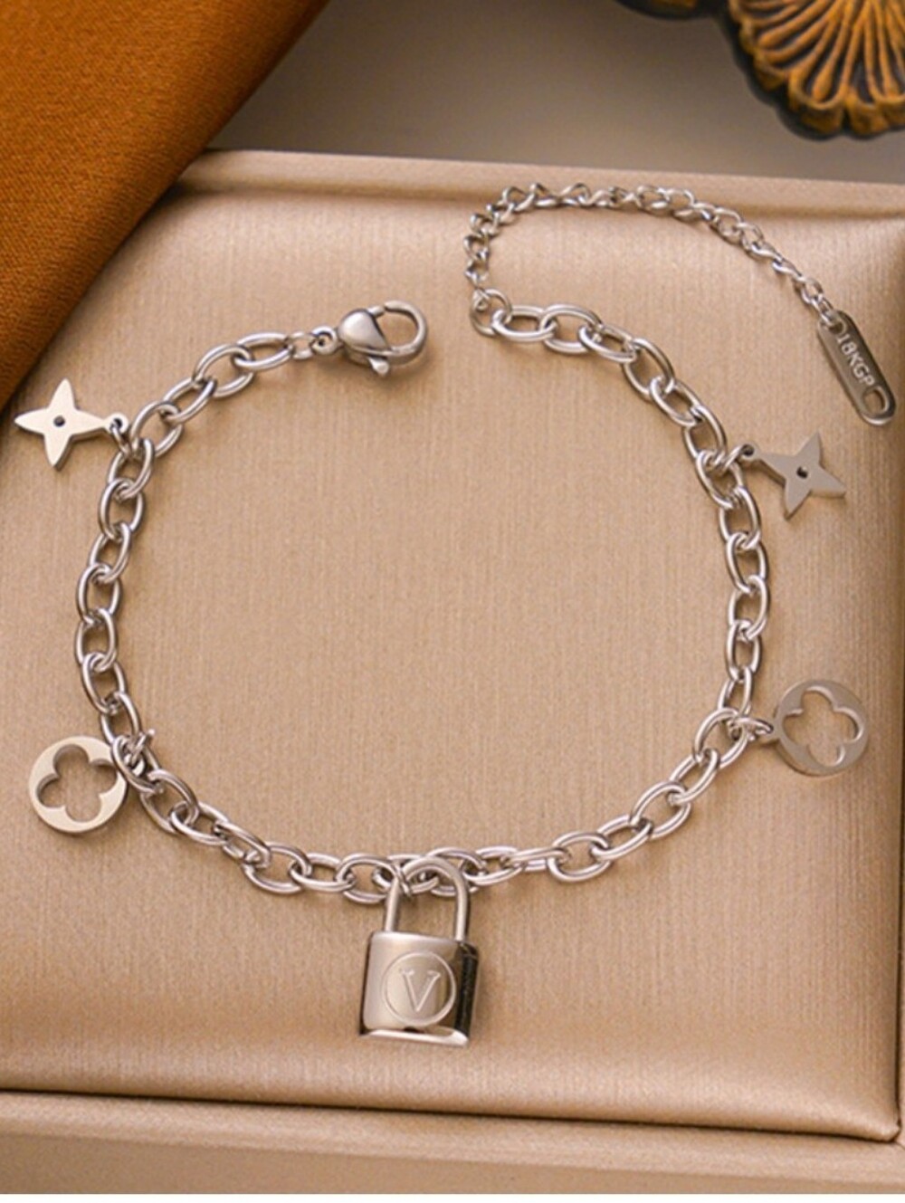 Silver Charm Bracelet with Stars and Floral Charm